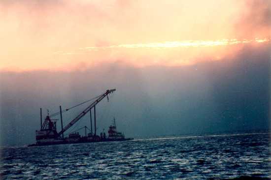 Trawler in a Foggy Sunset